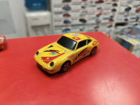 Porsche 911 Carrera желтый 1:43 Burago